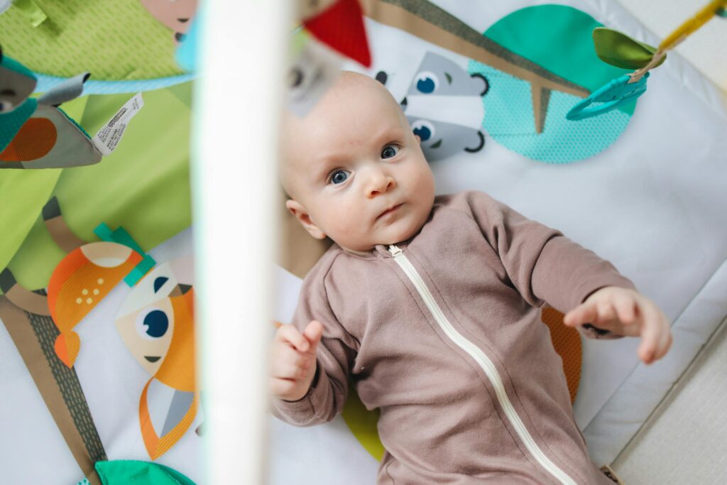 baby looking at bright ceiling light in nursery